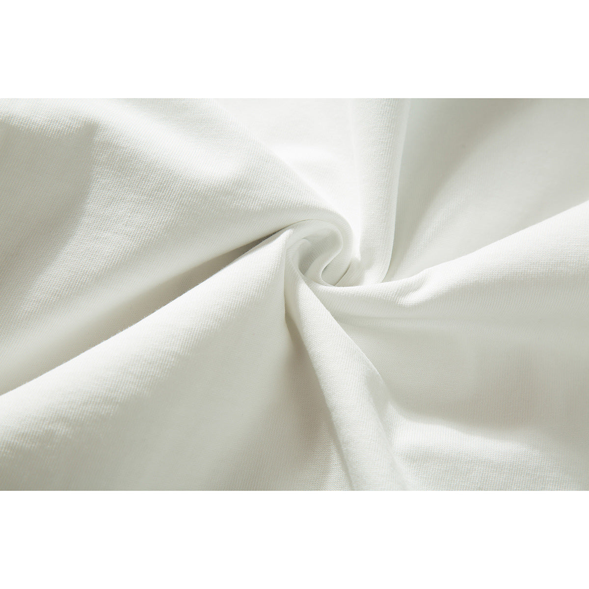 Close-up of off-white fabric gathered into a twist, showing its surface texture.