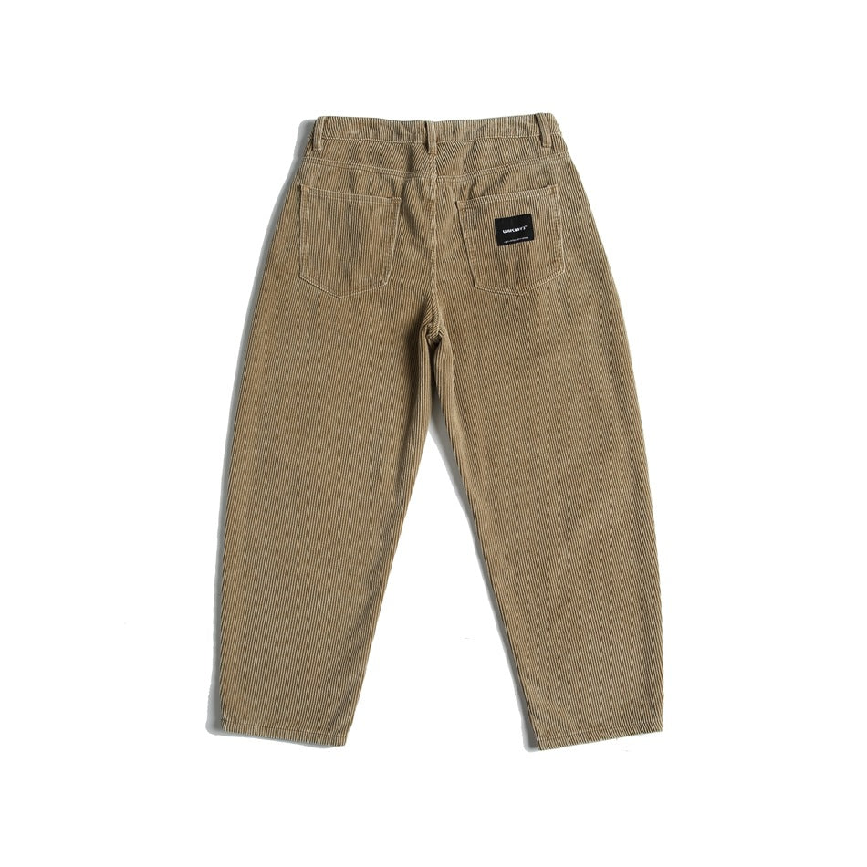 Full rear view of tan ribbed pants with two patch pockets and a black label.