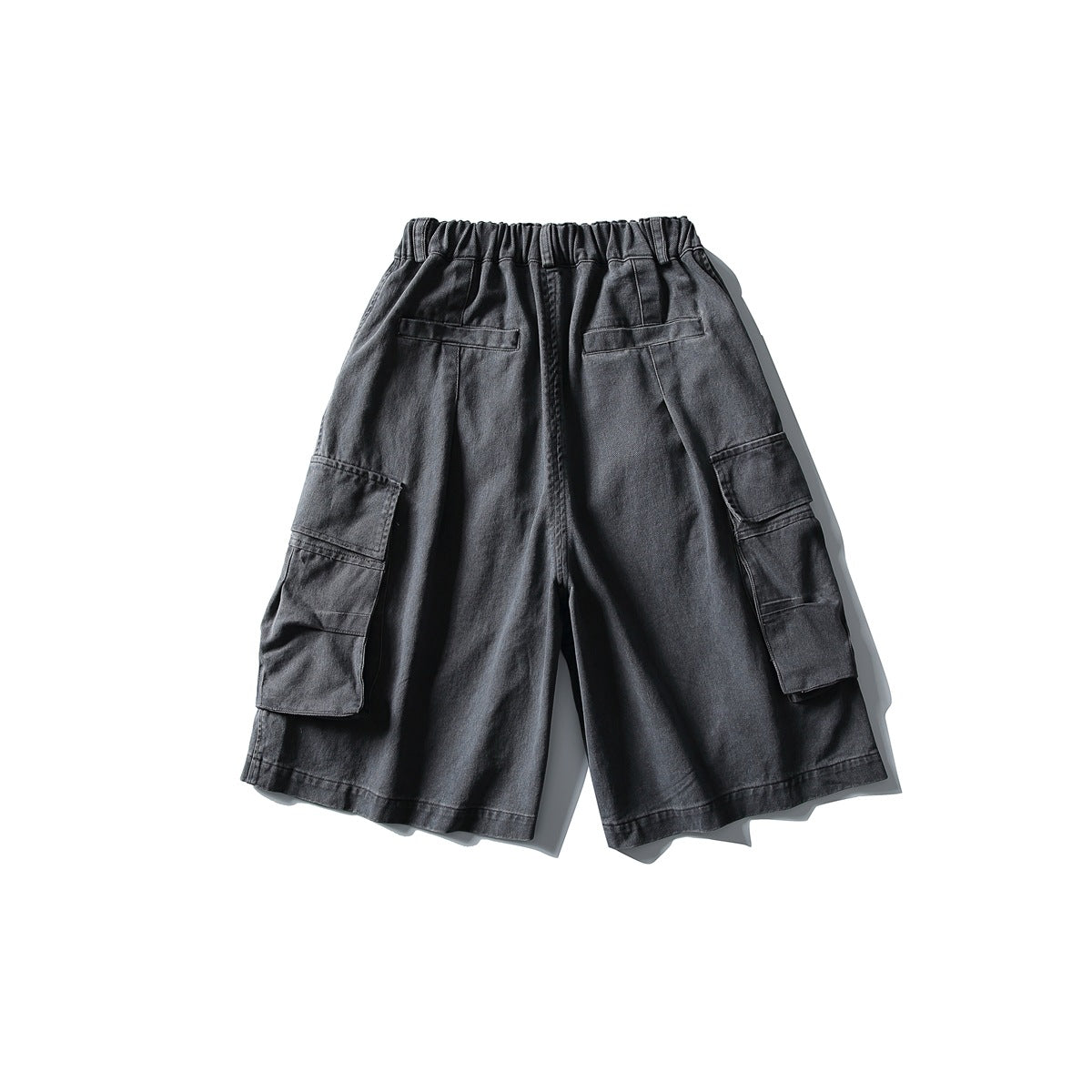 Back view of gray cargo shorts with elastic waistband, two back pockets and large side flap pockets