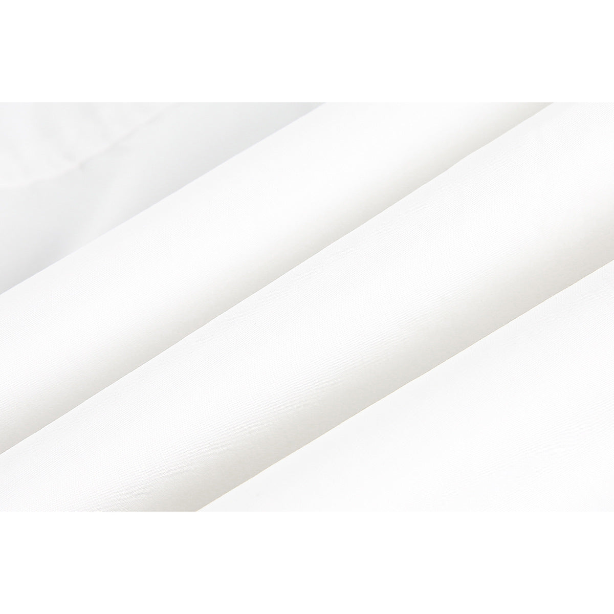 Close-up of folded white shirt fabric showing its fine surface texture.
