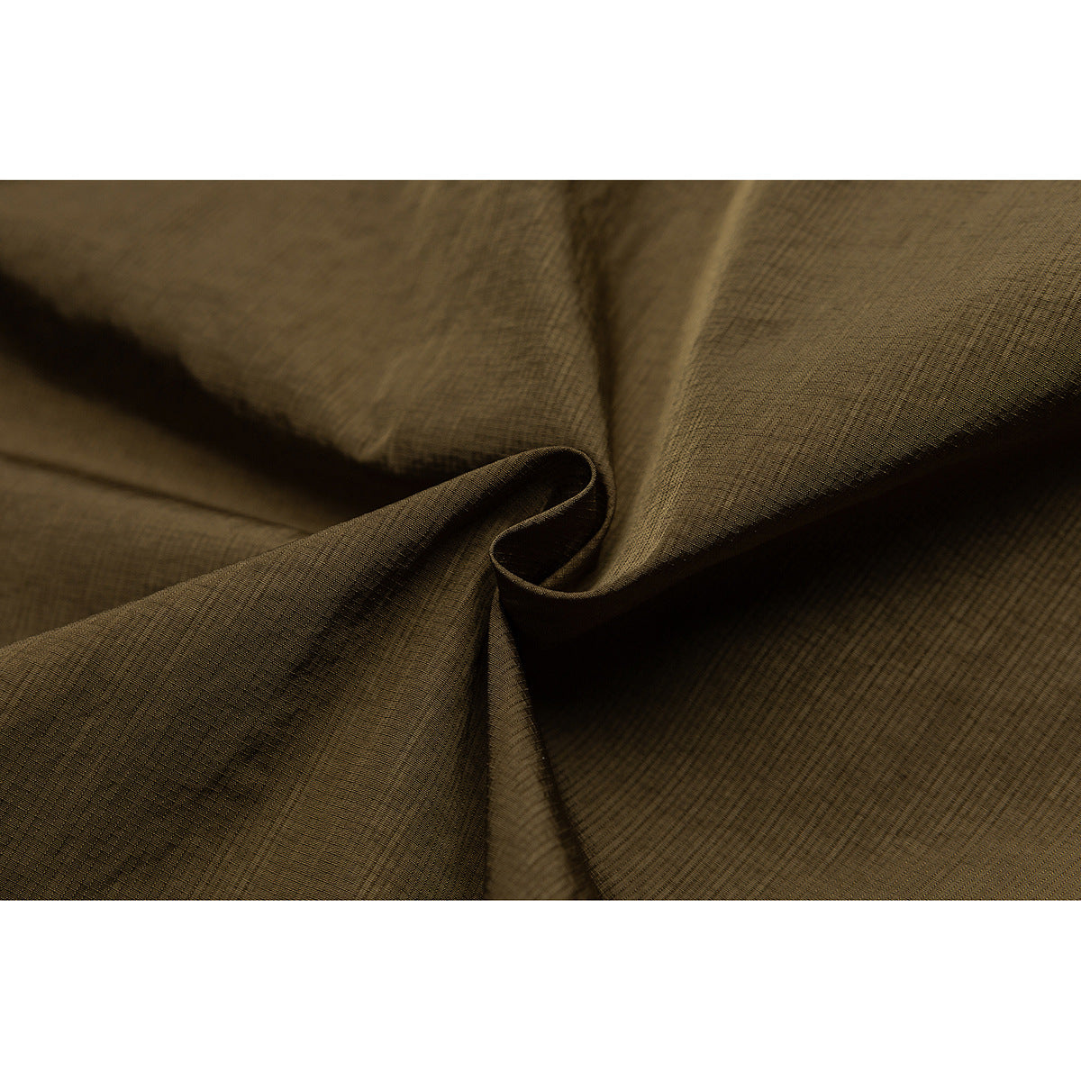 Macro view of olive-brown jacket fabric gathered to show its fine crosshatched texture.