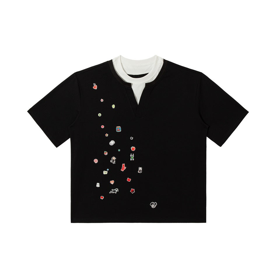 Black short-sleeve T-shirt with white inner collar layer, V-notch neckline and scattered cartoon sticker graphics