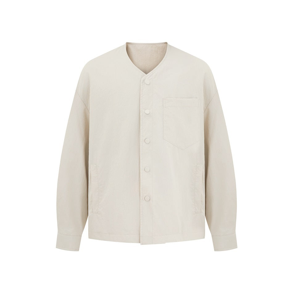 Beige collarless V-neck button-front jacket with chest pocket, front view on white background
