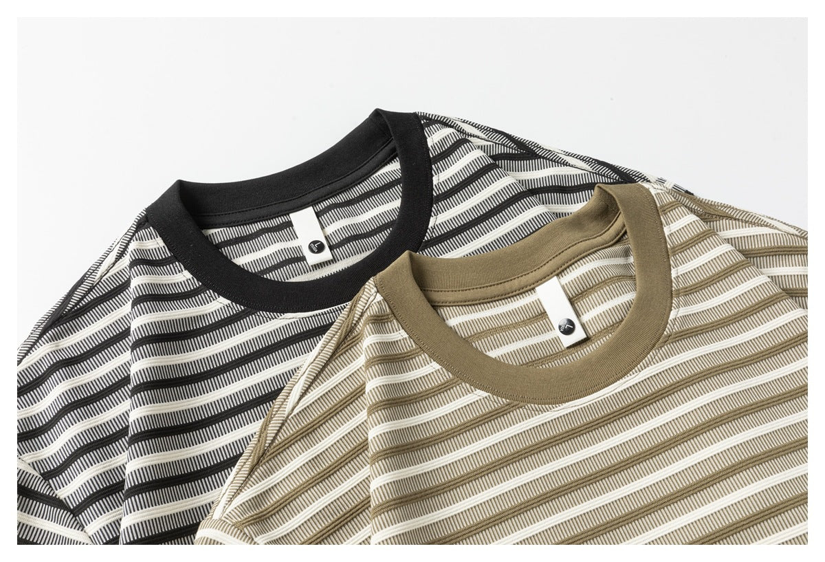 Close-up of two striped T-shirt necklines, one with a black collar and one with a taupe collar.