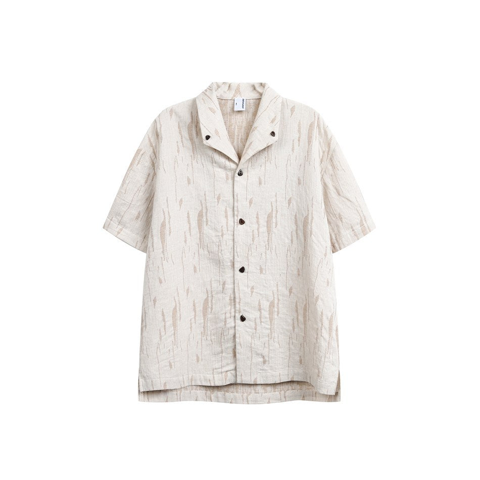 Cream short-sleeve button-front shirt with tan abstract streak pattern, open collar and dark buttons, flat view