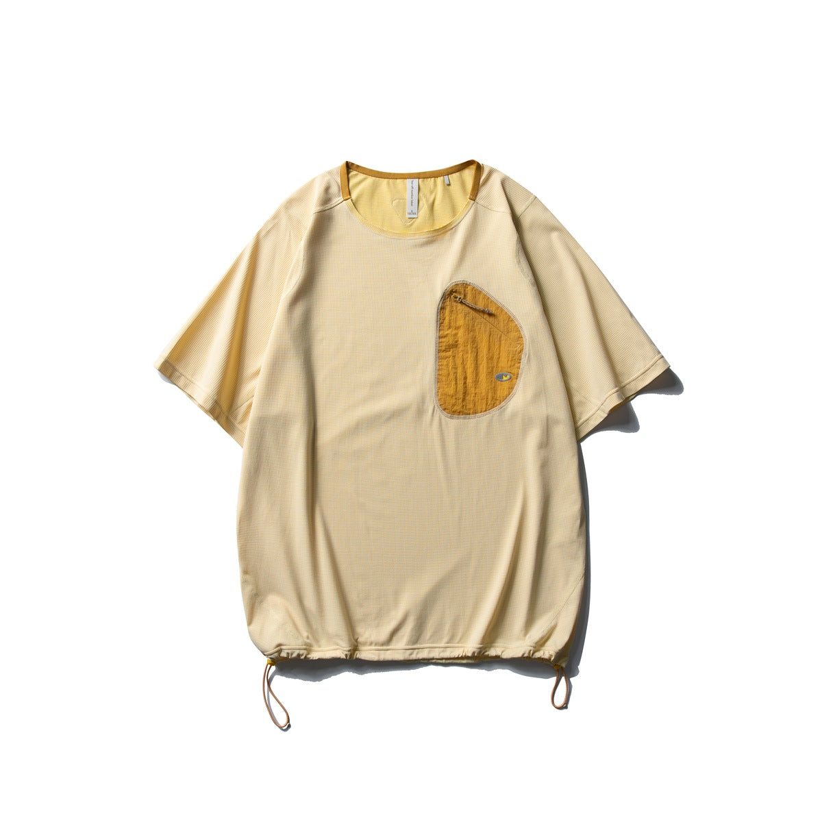 Light yellow short-sleeve T-shirt with mustard asymmetric zip chest pocket and drawcord hem