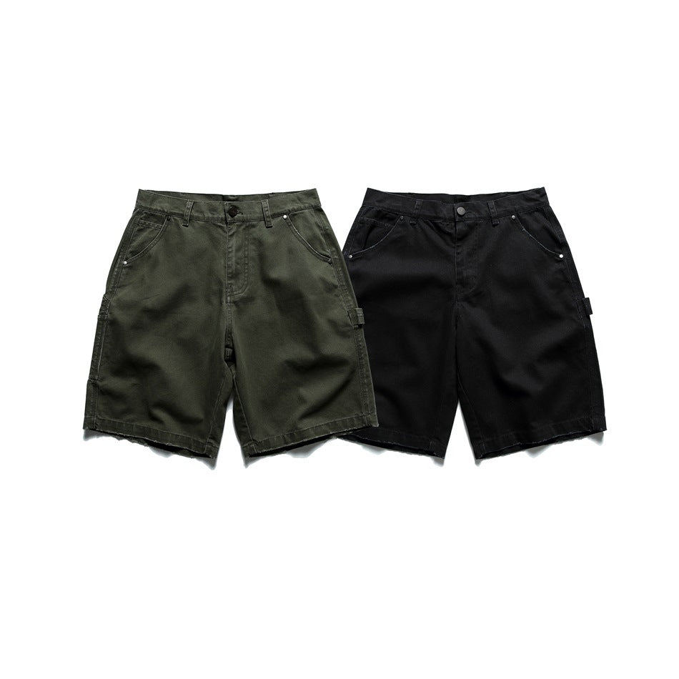 Front view of utility shorts in olive and black, shown side by side on a white background.