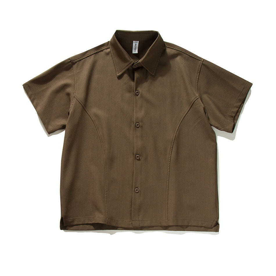 Coffee brown short-sleeve button-up shirt with pointed collar and curved front seams, flat lay front view