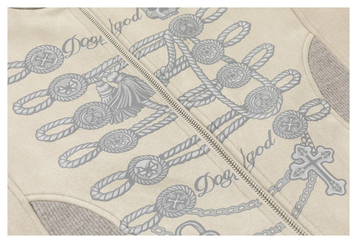 Close-up of the cream jacket's gray rope, chain and cross graphic beside its metal zipper.
