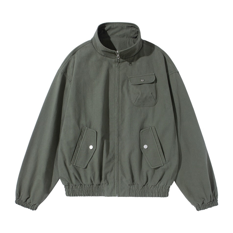 Army green zip-front jacket with stand collar, snap-flap chest and lower pockets, and elastic cuffs and hem, flat lay