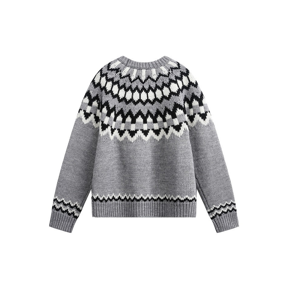 Back view of a gray Fair Isle crew-neck sweater with dark and white patterning and ribbed cuffs and hem.