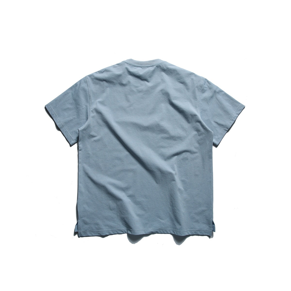 Back view of a plain slate blue short-sleeve crew-neck T-shirt on a white background.