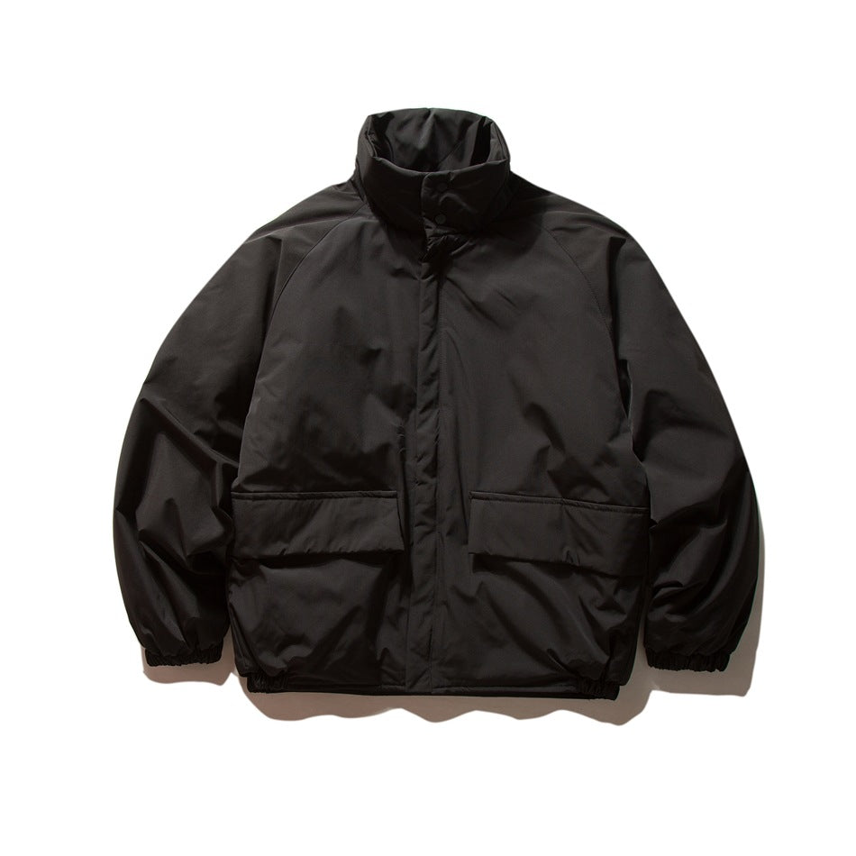 Black oversized stand-collar puffy jacket with two flap pockets and elastic cuffs, front flat view