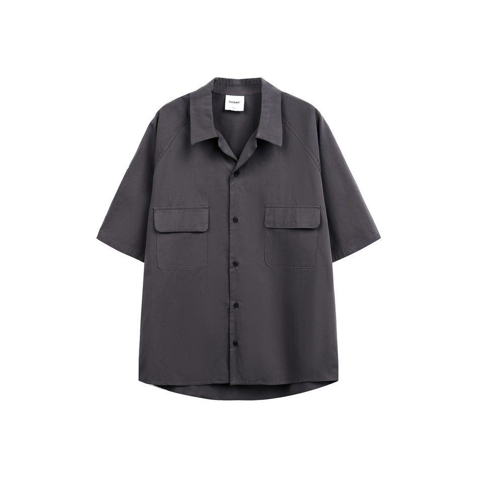 Charcoal short-sleeve button-up shirt displayed flat, with a pointed collar and two flap chest pockets.
