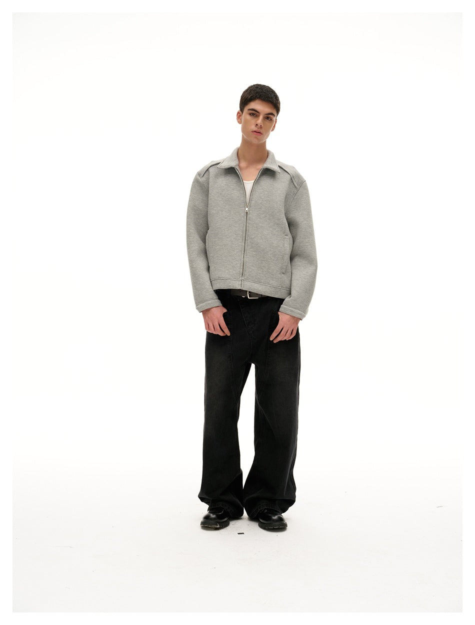 Full-length model wearing a light gray collared zip jacket over a white top and black wide-leg pants.