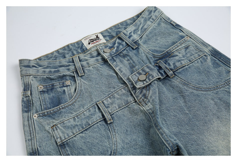 Cropped front view of light blue washed jeans with curved pockets, belt loops, and a button fly.