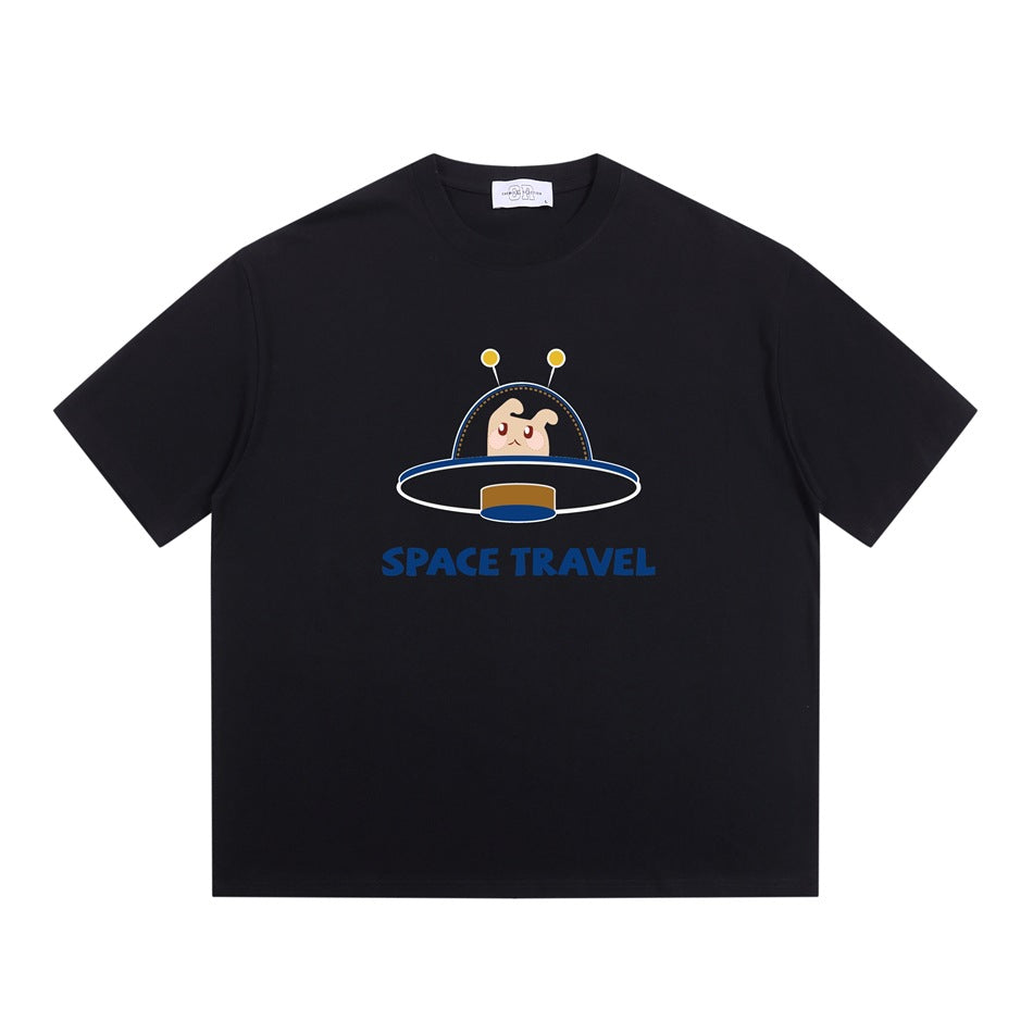 Black short-sleeve crew-neck T-shirt with a cartoon UFO creature graphic and blue 'SPACE TRAVEL' text, flat lay