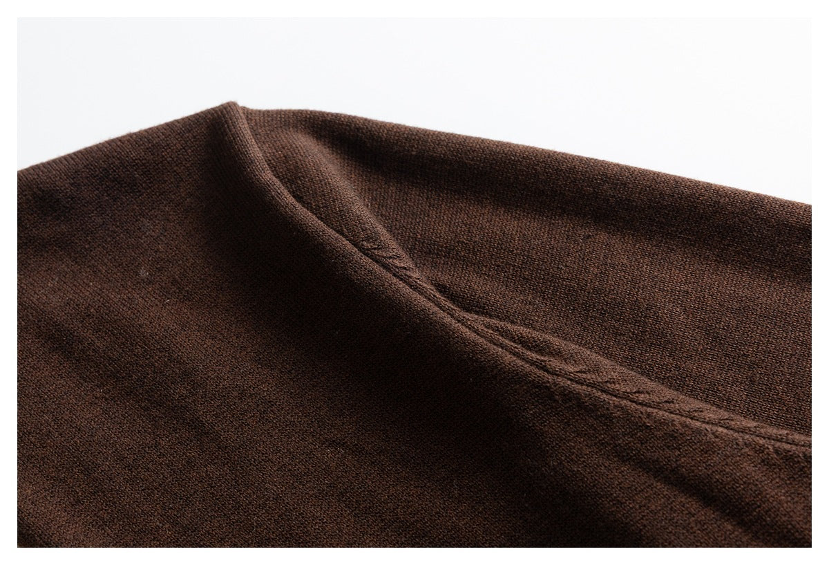 Close-up of the dark brown knit fabric and a diagonal stitched seam.