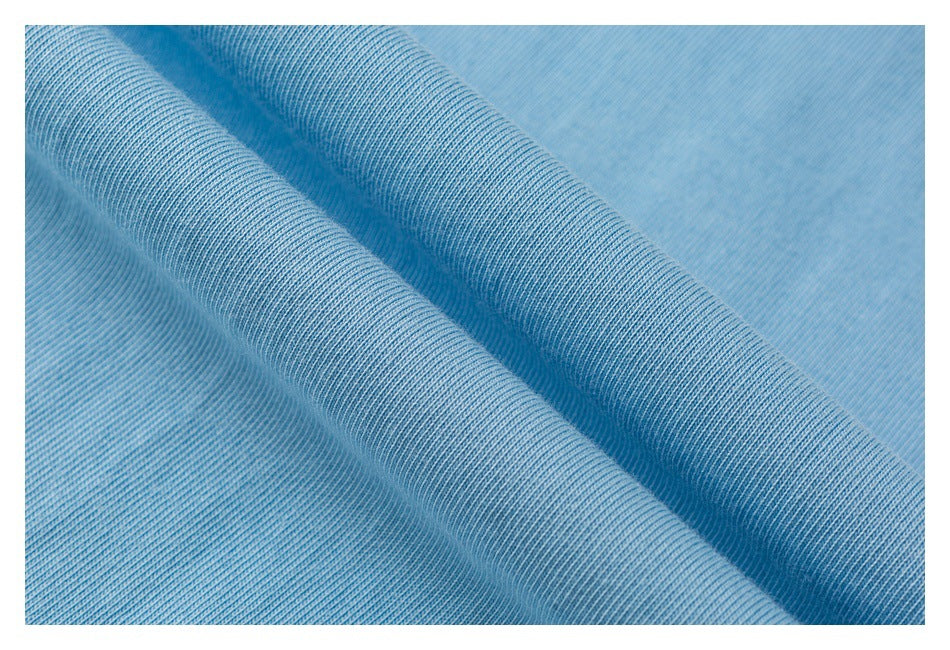 Close-up of light blue ribbed fabric arranged in soft folds.