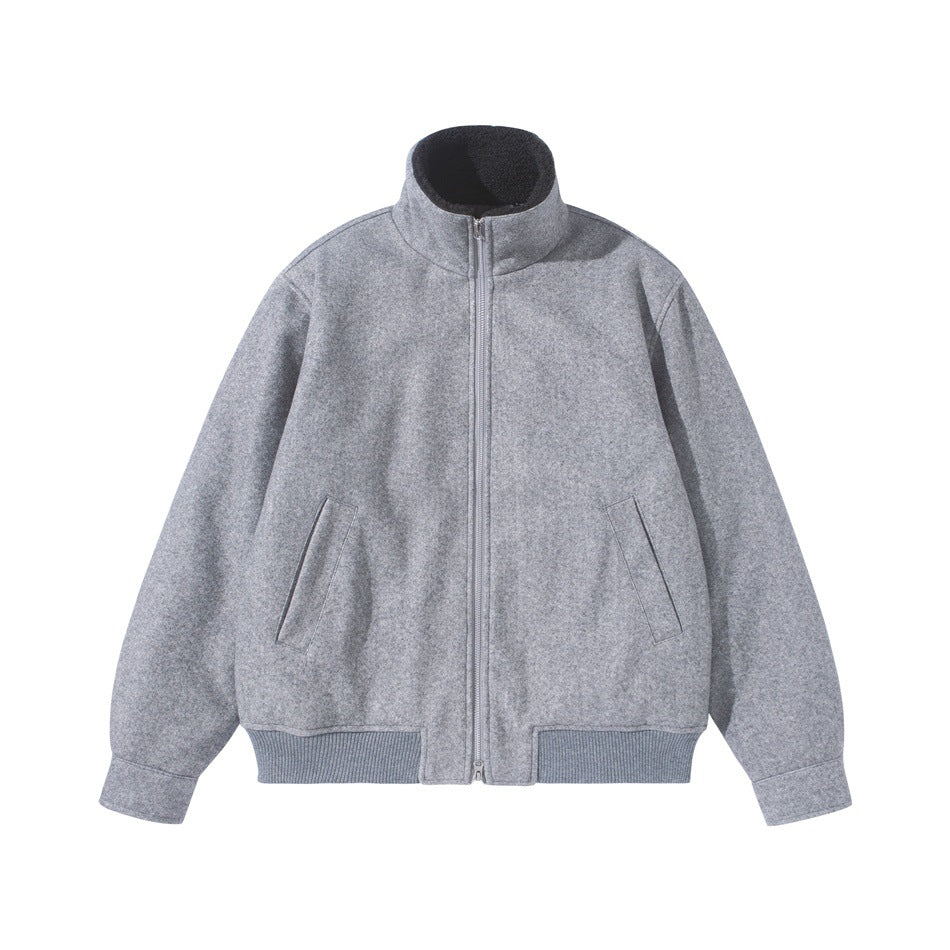 Gray stand-collar zip-up jacket with slanted pockets and ribbed hem, front flat lay
