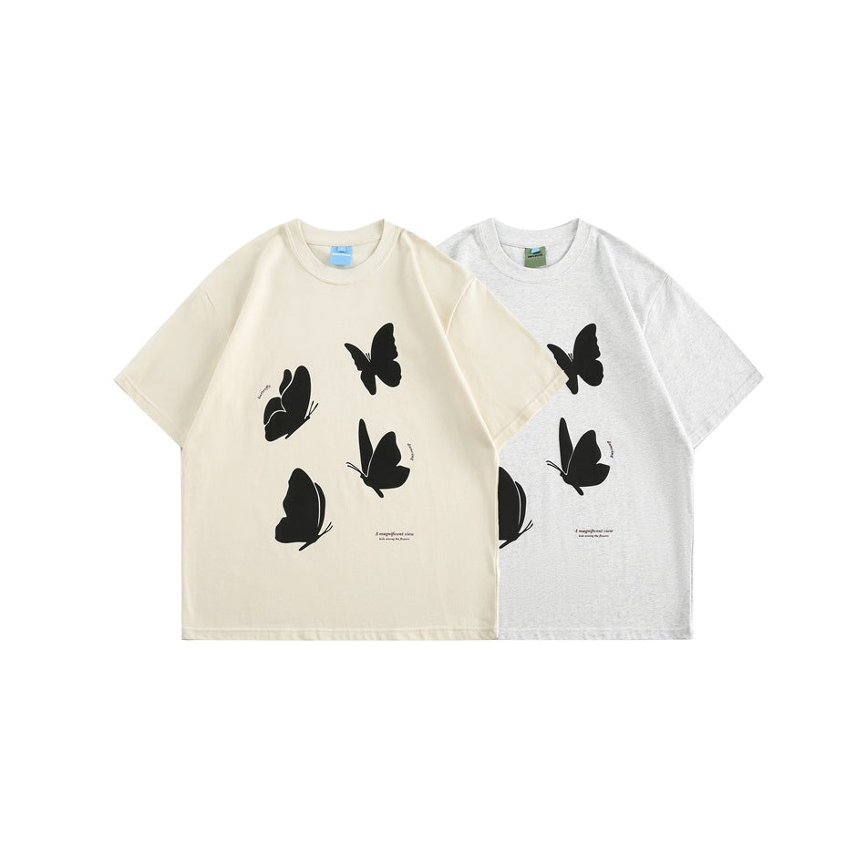 Front view of cream and heather-gray short-sleeve T-shirts with black butterfly graphics.