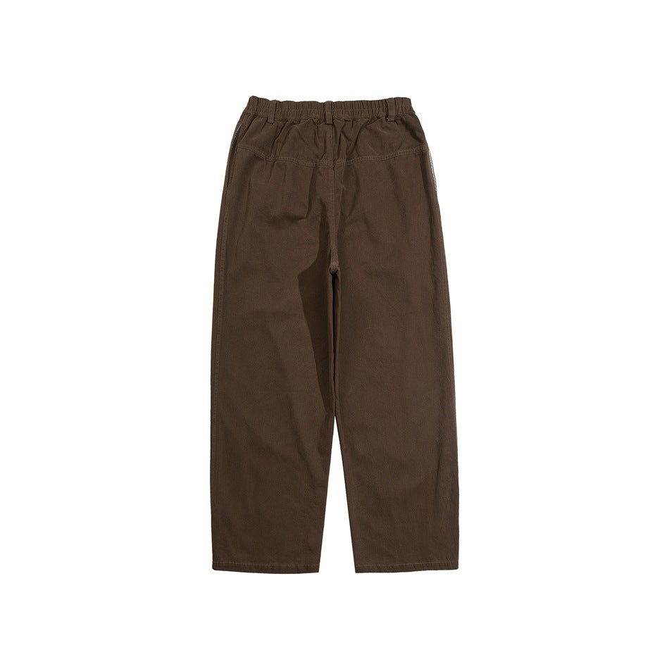 Front view of dark brown wide-leg pants with an elastic waist, belt loops, and angled pockets on a white background.