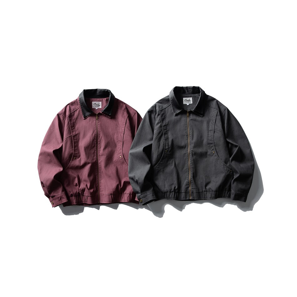 Two jackets shown from the front: one burgundy and one dark gray, both with black collars and front zippers.