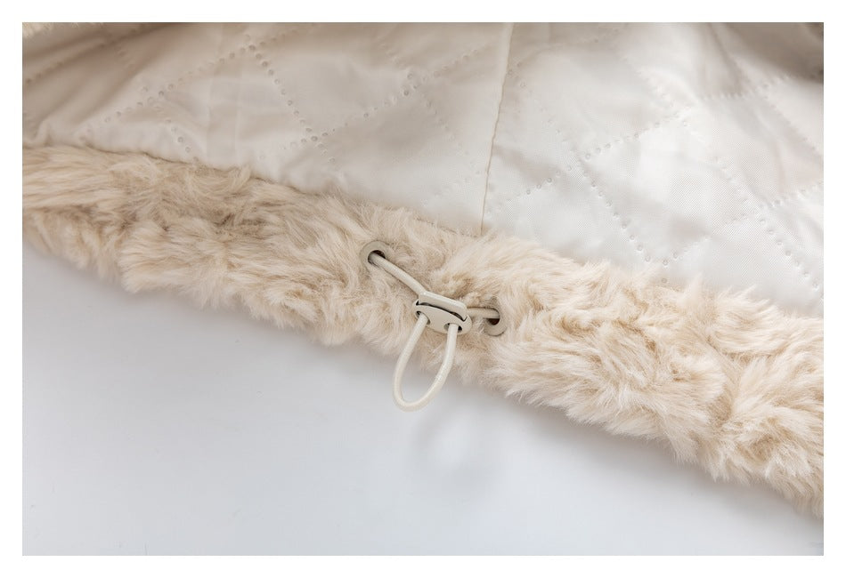 Cream fluffy garment edge with a white lining and adjustable drawcord toggle.