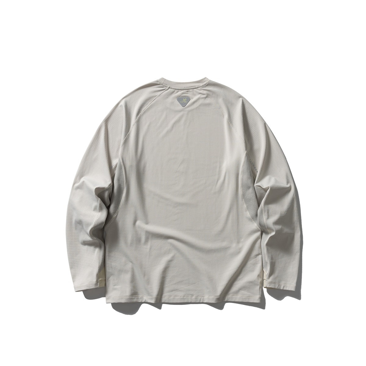 Back view of a light gray long-sleeve raglan shirt with a small upper-back patch.