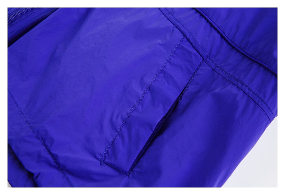 Close-up of a slanted pocket on the blue jacket.