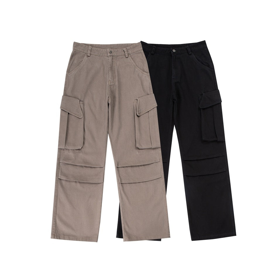 Two pairs of loose cargo pants shown together: one taupe and one black, each with large flap pockets.
