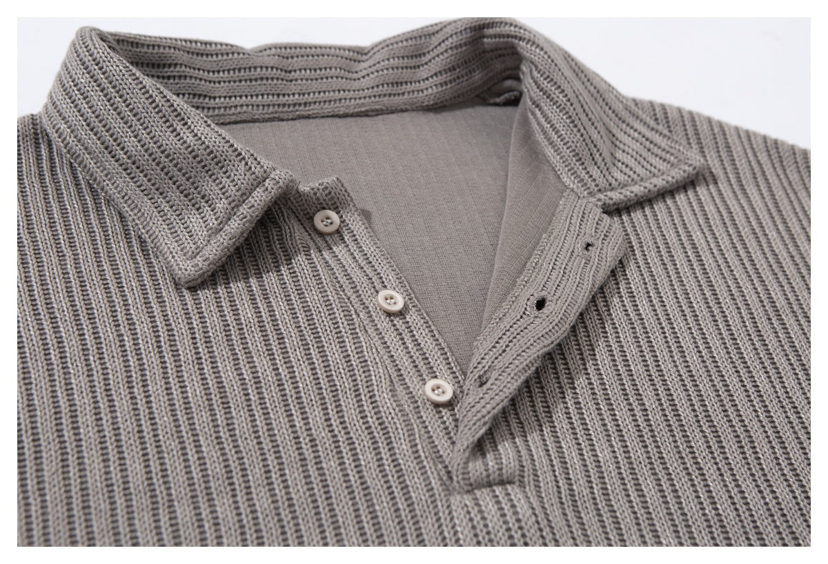 Close-up of the gray ribbed top’s open collar, inner neckline, and button placket.