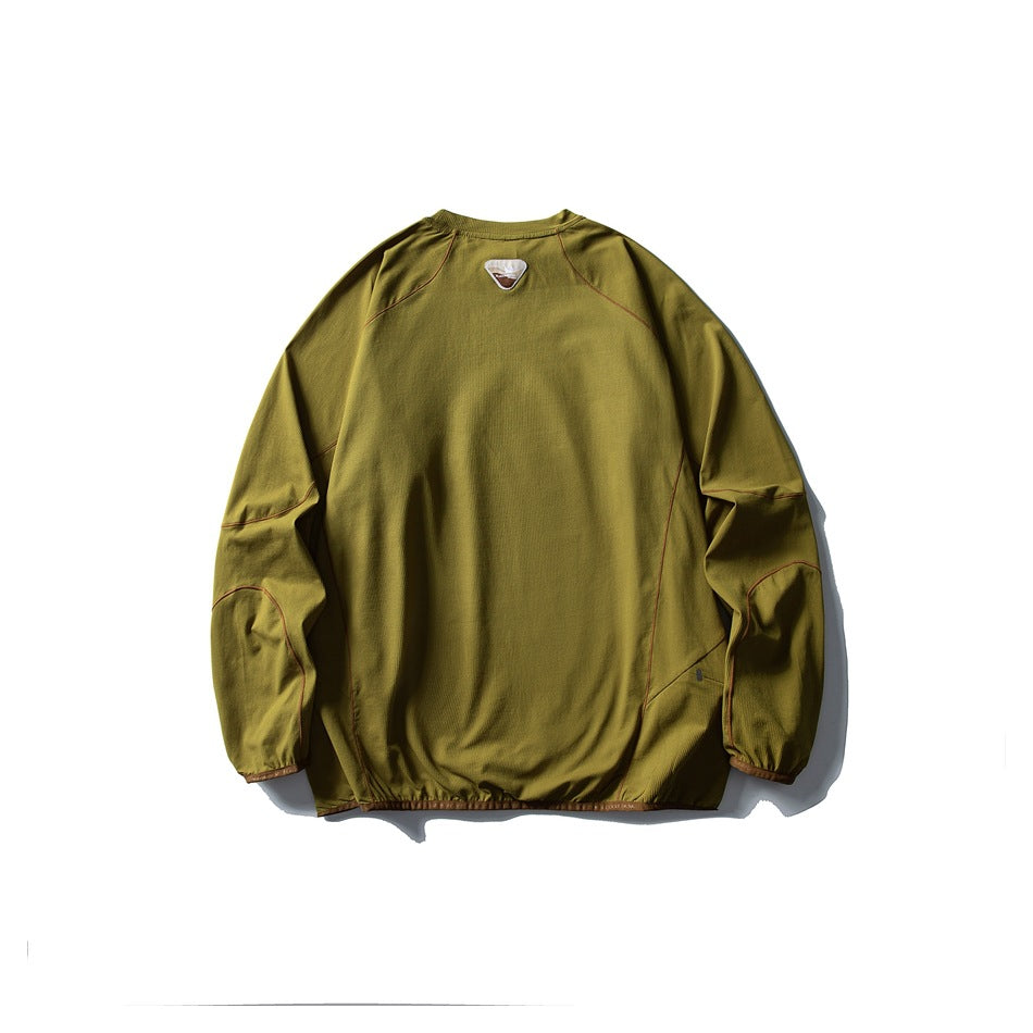 Back view of an olive green pullover with long raglan sleeves and rust-colored contrast piping.