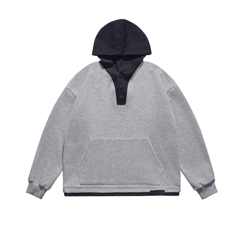 Heather gray pullover hoodie with dark denim-look hood, button placket, front pocket and dark layered hem, flat view