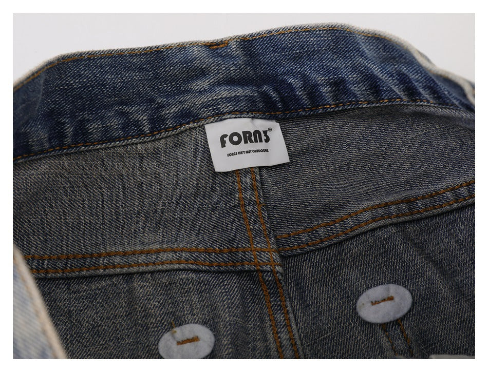 Inside waistband close-up of faded blue jeans with a white FORN label and stitched seams.