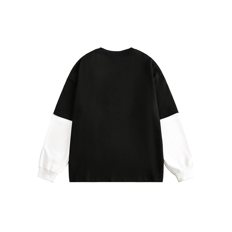 Back view of a black sweatshirt with white contrasting sleeves and ribbed cuffs.