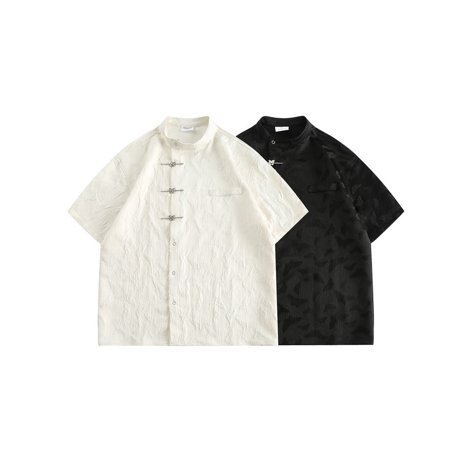 White and black short-sleeve stand-collar shirts with butterfly texture, front closures, and small chest pockets.