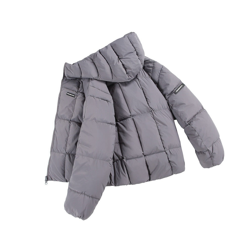 Gray quilted hooded puffer jacket laid at an angle with the front open, showing the interior and sleeve patch