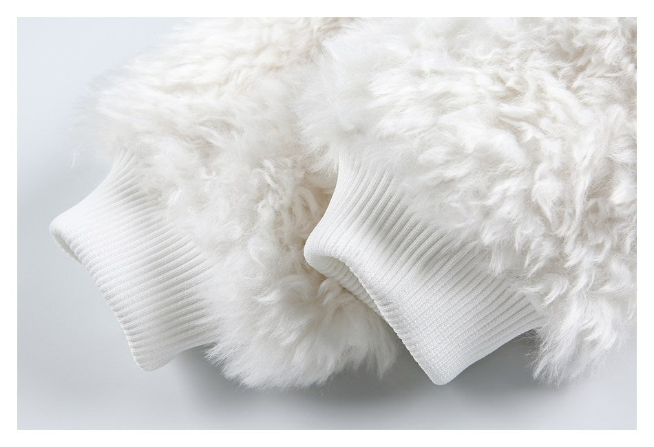 Close-up of the jacket's fluffy white sleeves and ribbed cuffs.