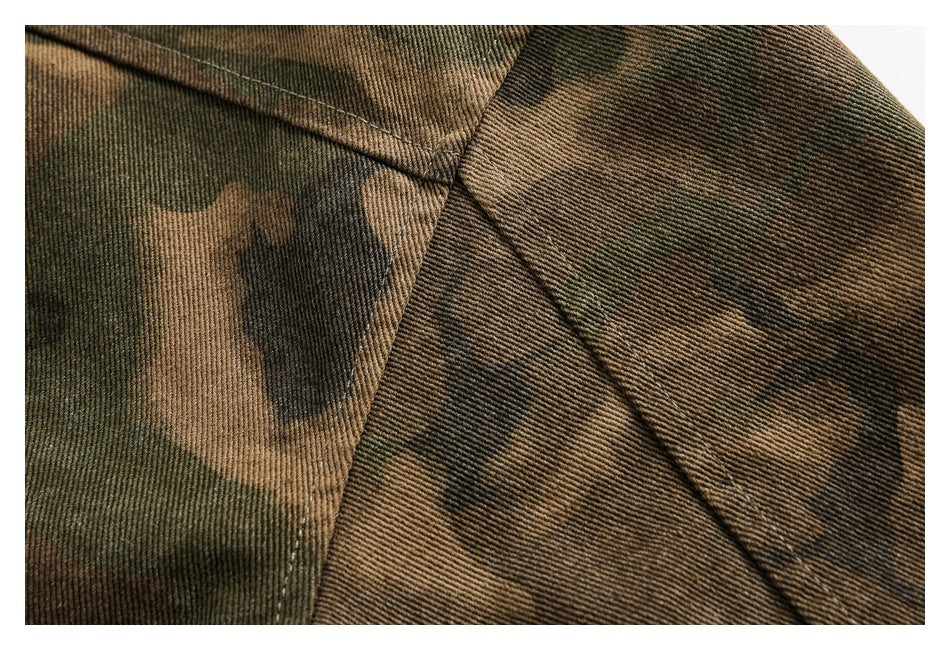 Close-up of camouflage fabric joined to a solid brown panel with visible stitching.