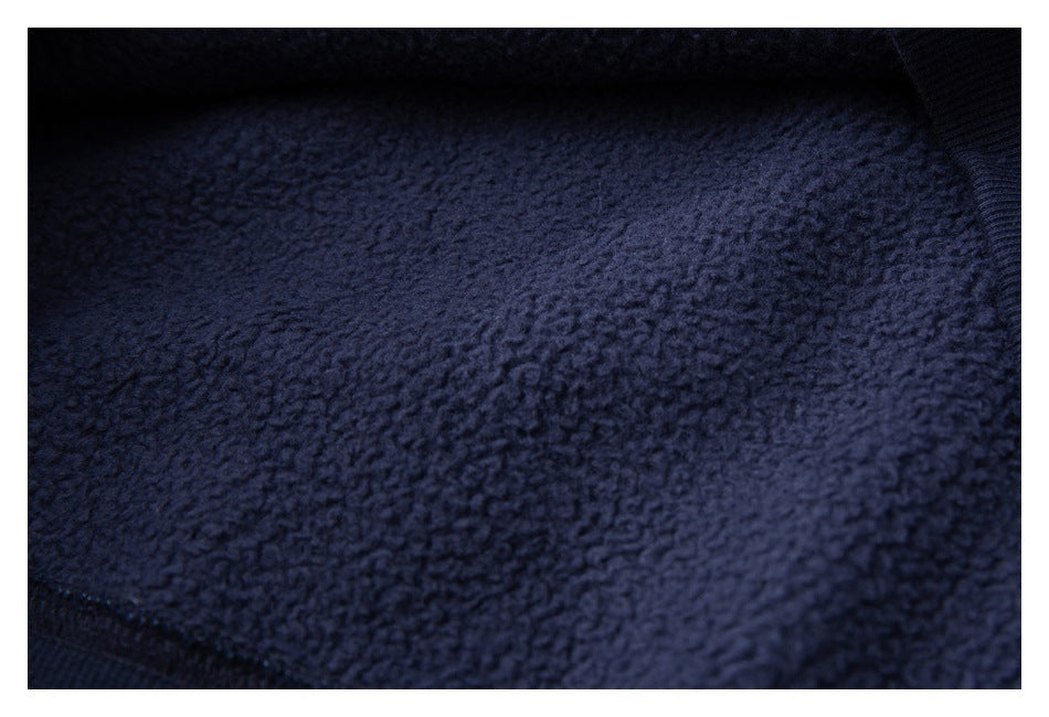 Close-up of the dark navy garment's textured inner lining.