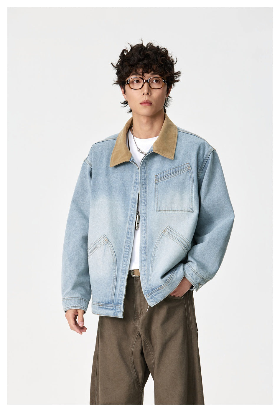 Model wearing a light-wash denim jacket with a tan collar, zip front and three pockets.