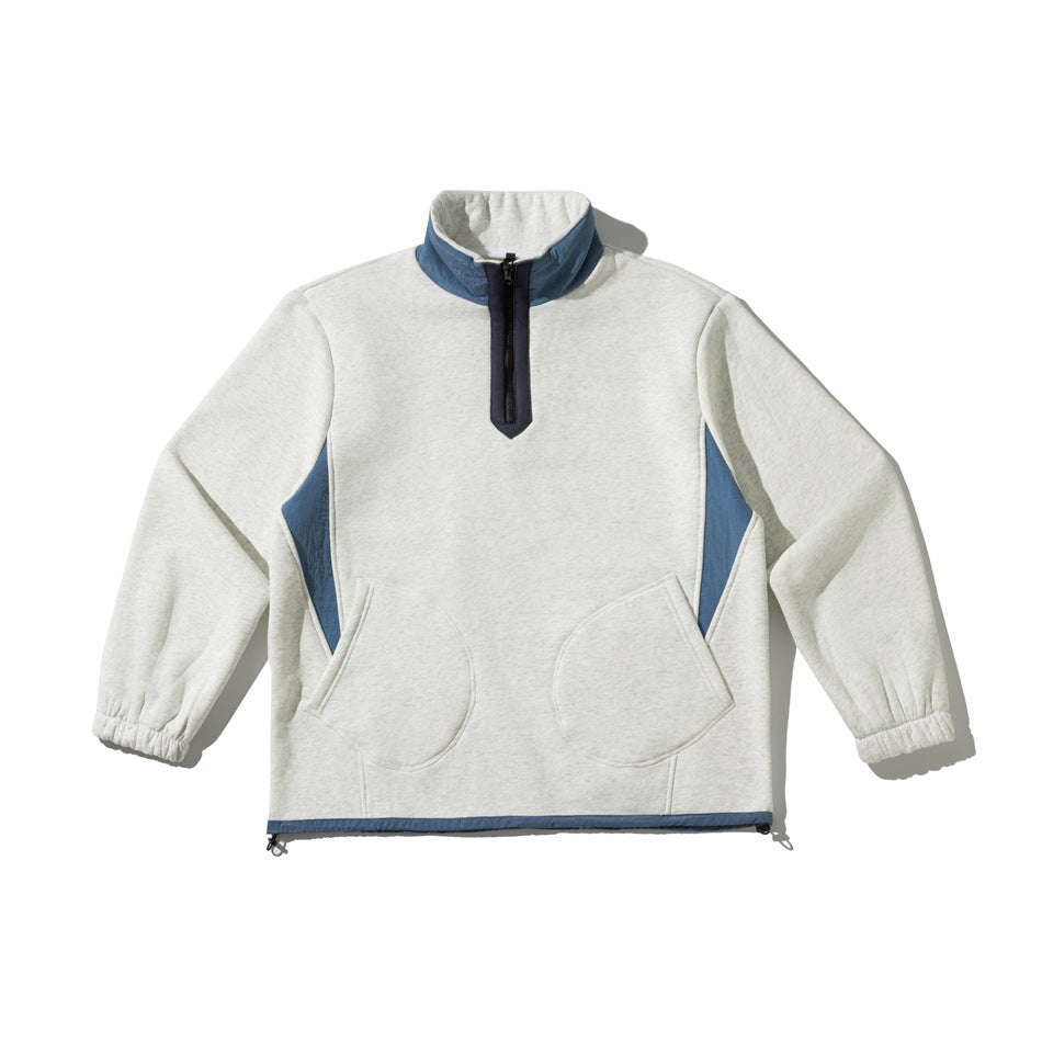 Heather gray half-zip pullover sweatshirt with blue collar and side panels, navy zip placket and two round front pockets