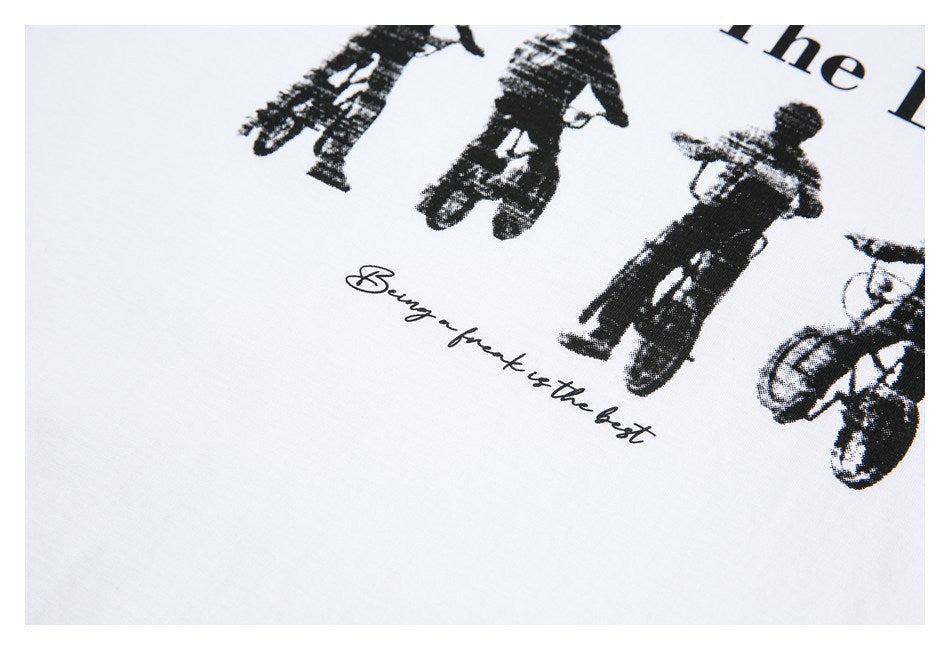 Close-up of a black graphic and cursive English text printed on white fabric.