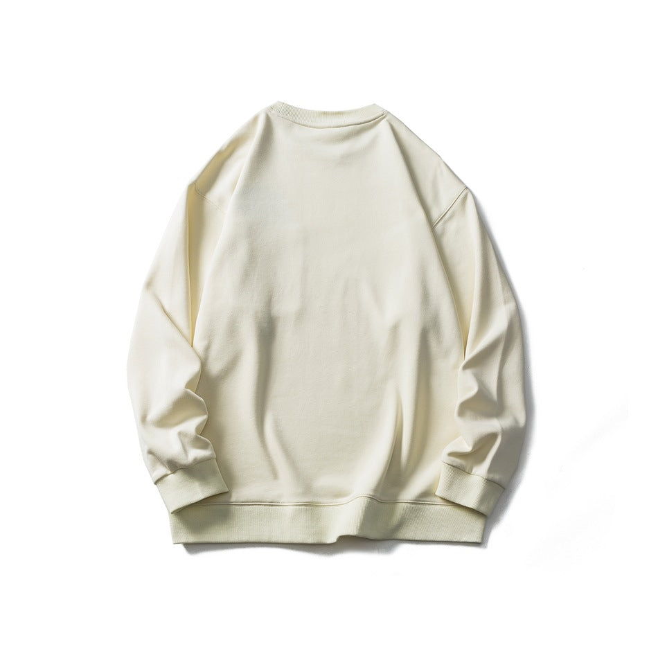 Flat lay of a plain cream crewneck sweatshirt, shown from the back with ribbed collar, cuffs, and hem.