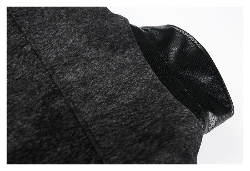 Close-up of the charcoal jacket sleeve with a glossy black reptile-textured cuff.