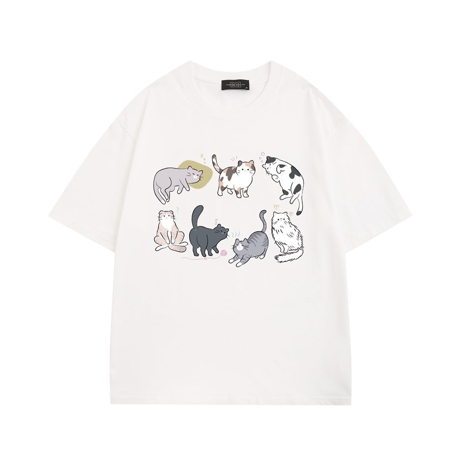 White short-sleeve crew-neck T-shirt with a front graphic of seven illustrated cats in various poses