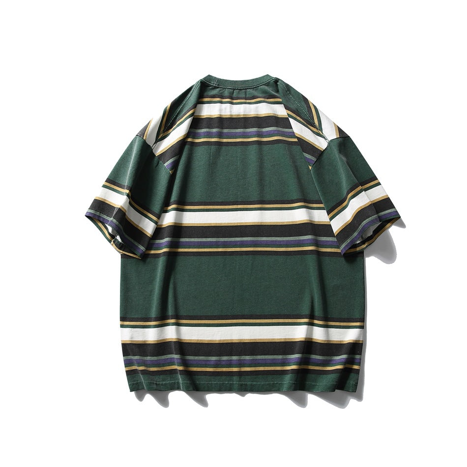 Back view of a loose dark green short-sleeve T-shirt with broad white and narrow multicolor horizontal stripes.