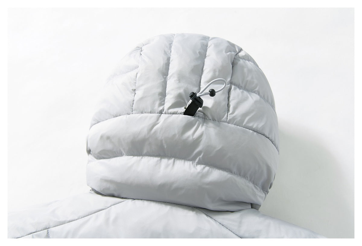 Close-up of the light gray jacket hood with quilted panels and an adjustable cord toggle.
