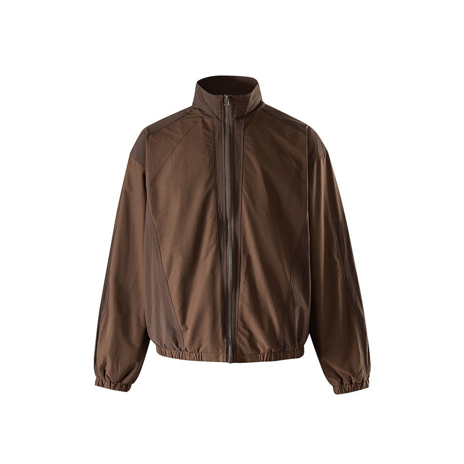 Brown stand-collar zip jacket with darker tonal panels, elastic cuffs and hem, front view on white background